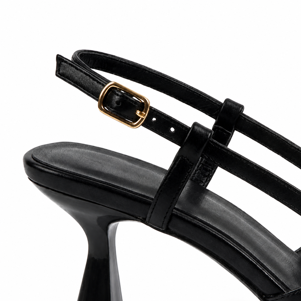 The small gold buckle on the slingback strap